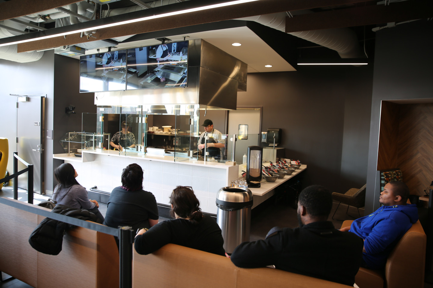 Chef Francisco cooking a quesadilla in the demo kitchen in the ܽƵ Student Center with students watching.